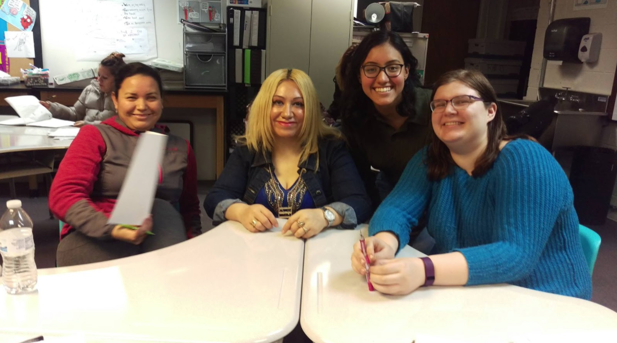 First-years Ashley Diaz and Laura Parker sit with two advanced students during a tutoring session.