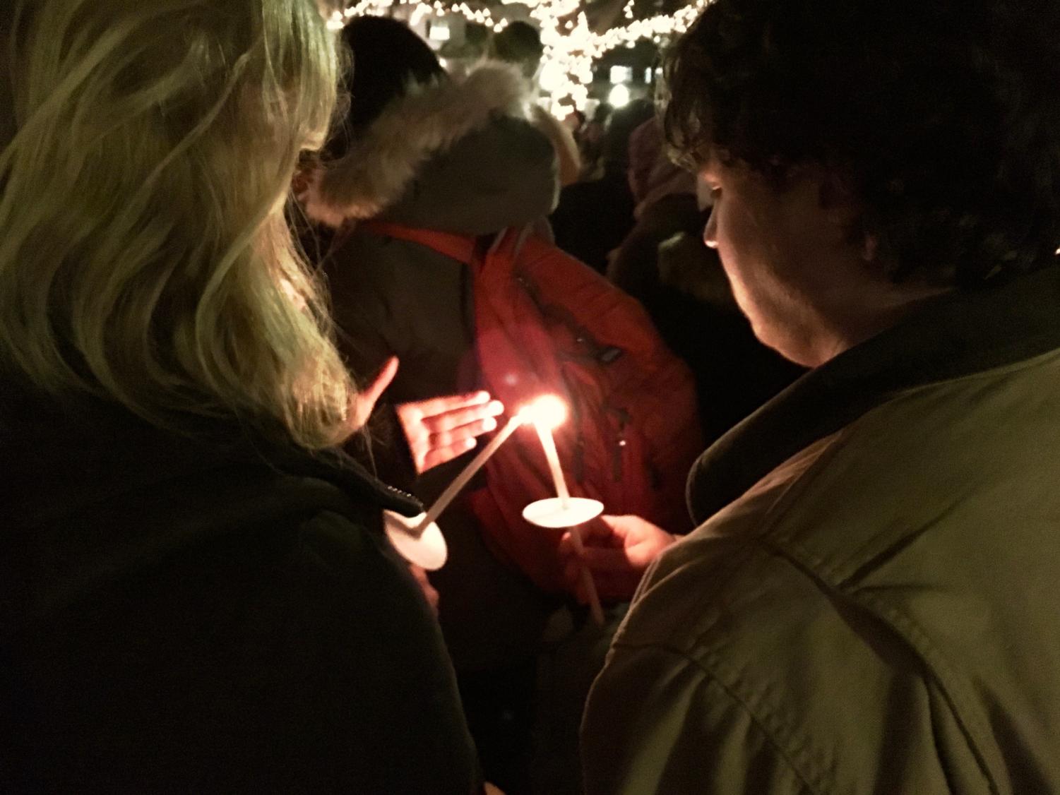 Students lit candles in memory of the Quebec City massacre victims.