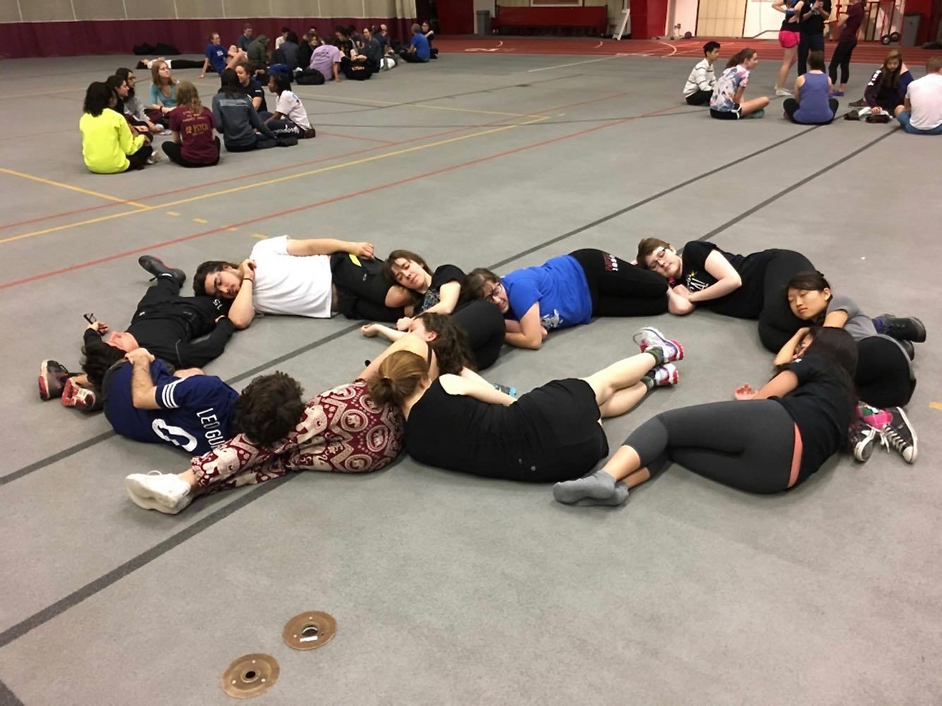 Students nap together before Kuvia exercises begin.