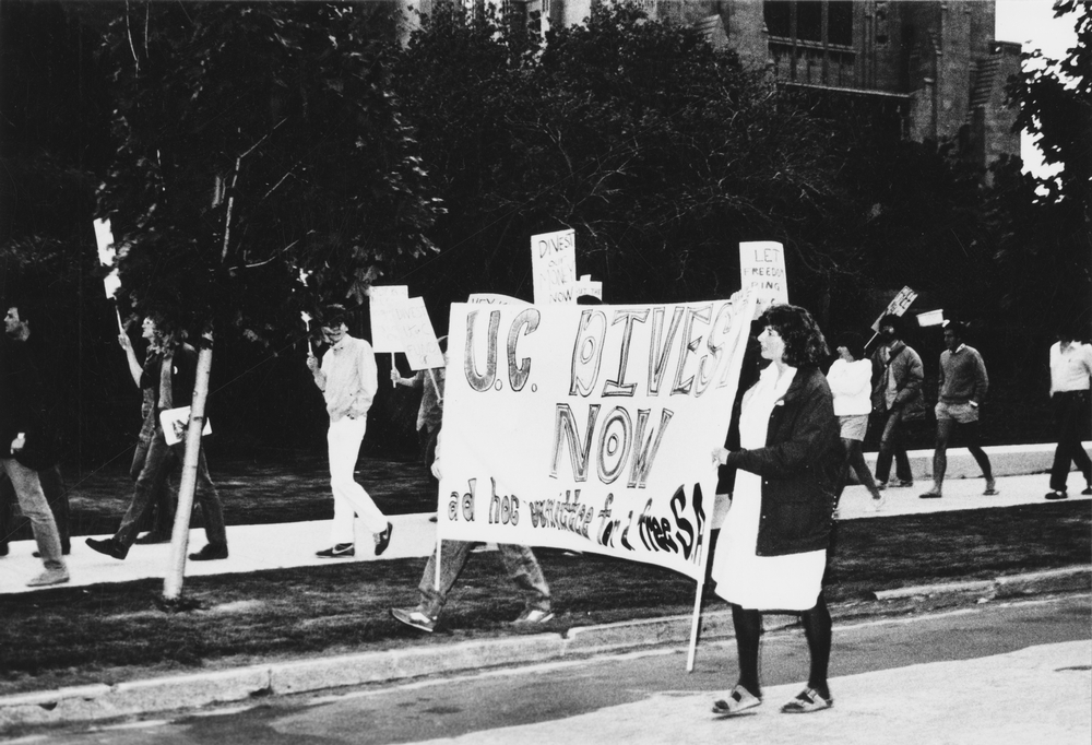 Students from the Ad Hoc Committee for a free South Africa march on the quad in the 1980s, calling for divestment from the apartheid regime governing South Africa.