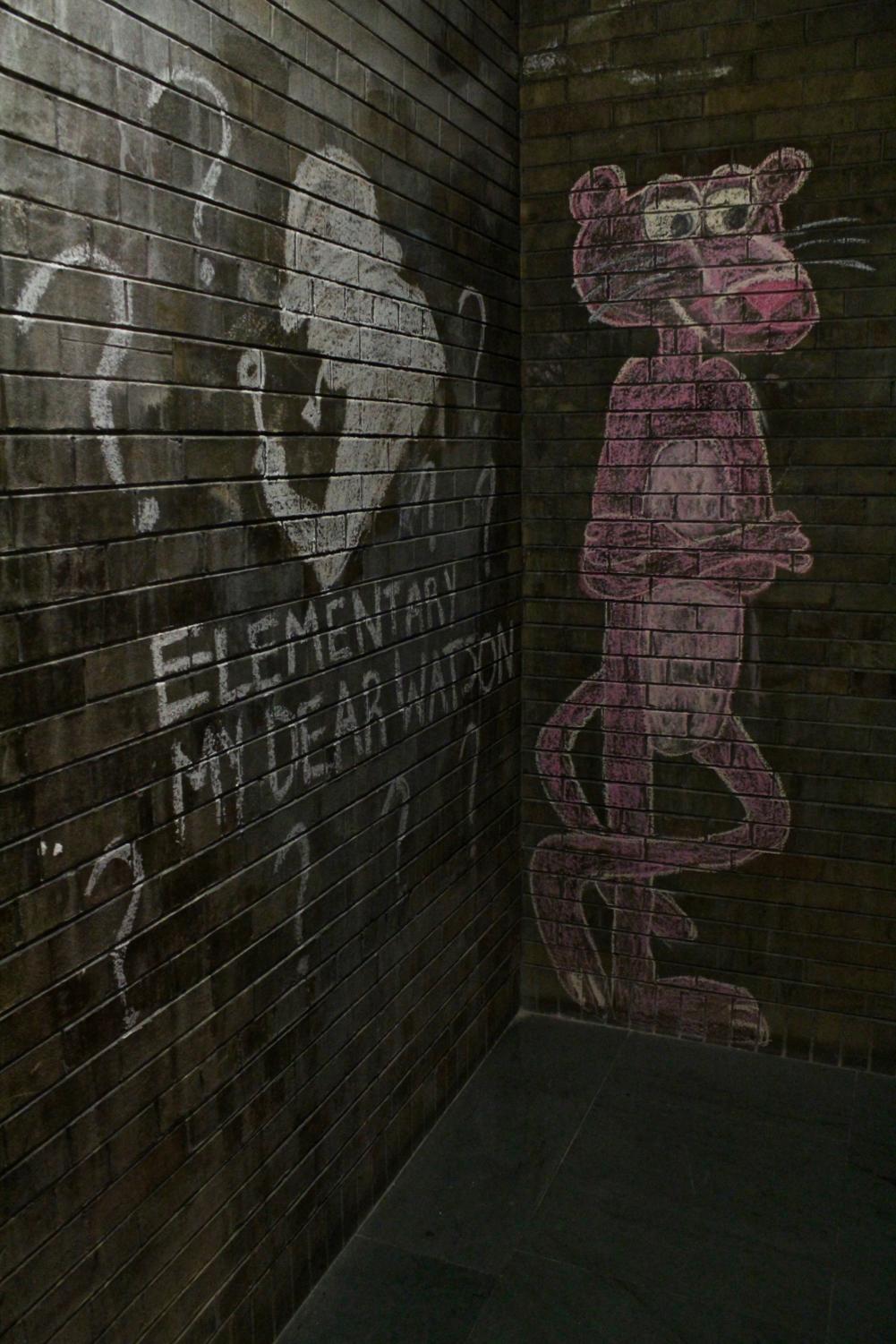 Spy-themed images etched on the brick walls by O-Aids and other leaders of Chamberlin House before first-years arrived.