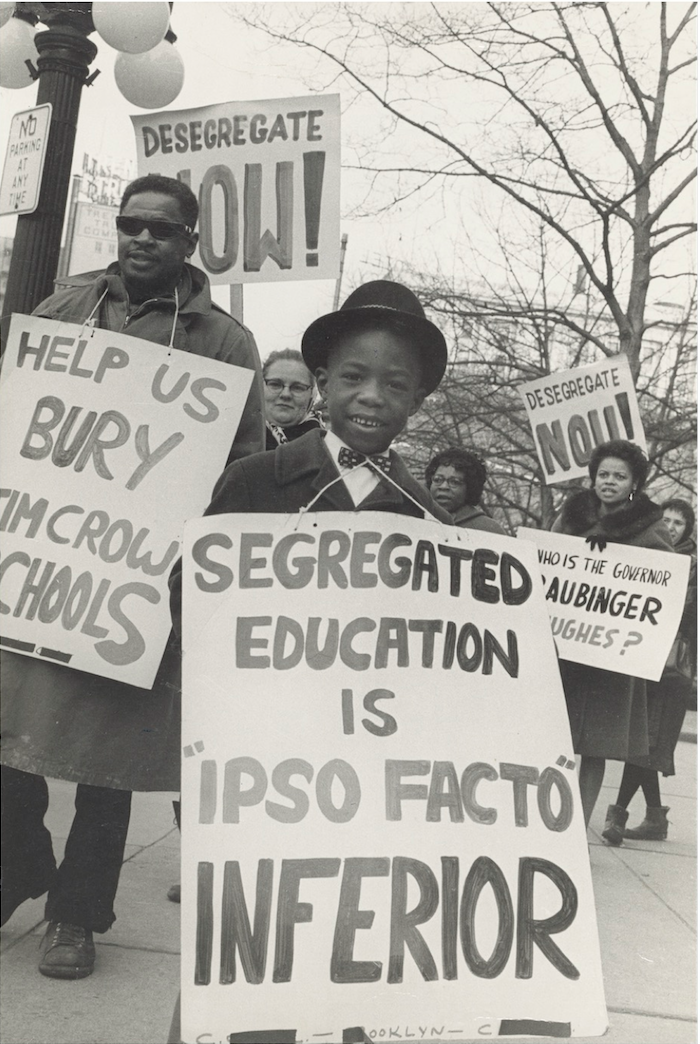 Boy picketing outside a local school, one of the many children from coast to coast who would play a critical role during the civil rights era to advance the struggle for racial justice.