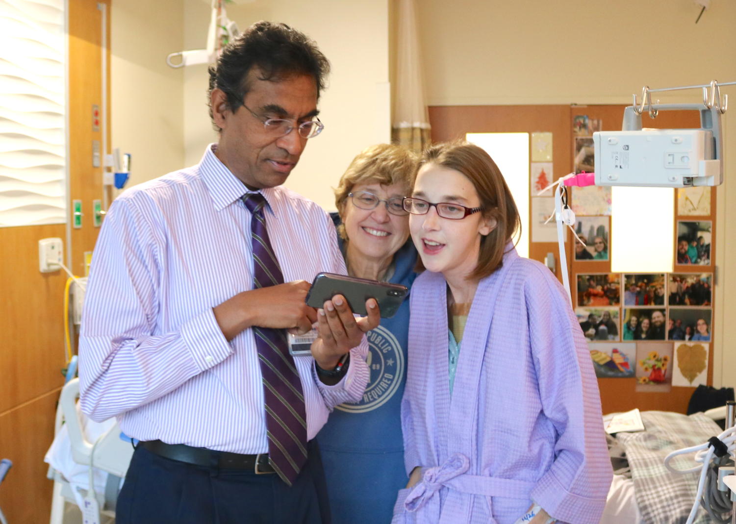 Valluvan Jeevanandam, MD, one of the physicians involved with the surgery, with Sarah McPharlin and her mother.