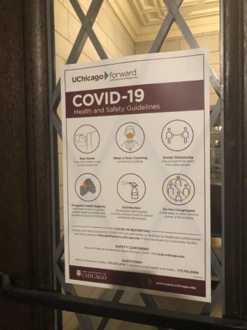 A University-produced flyer on the door of the Social Science Research Building shares “COVID-19 Health and Safety Guidelines,” including social distancing.