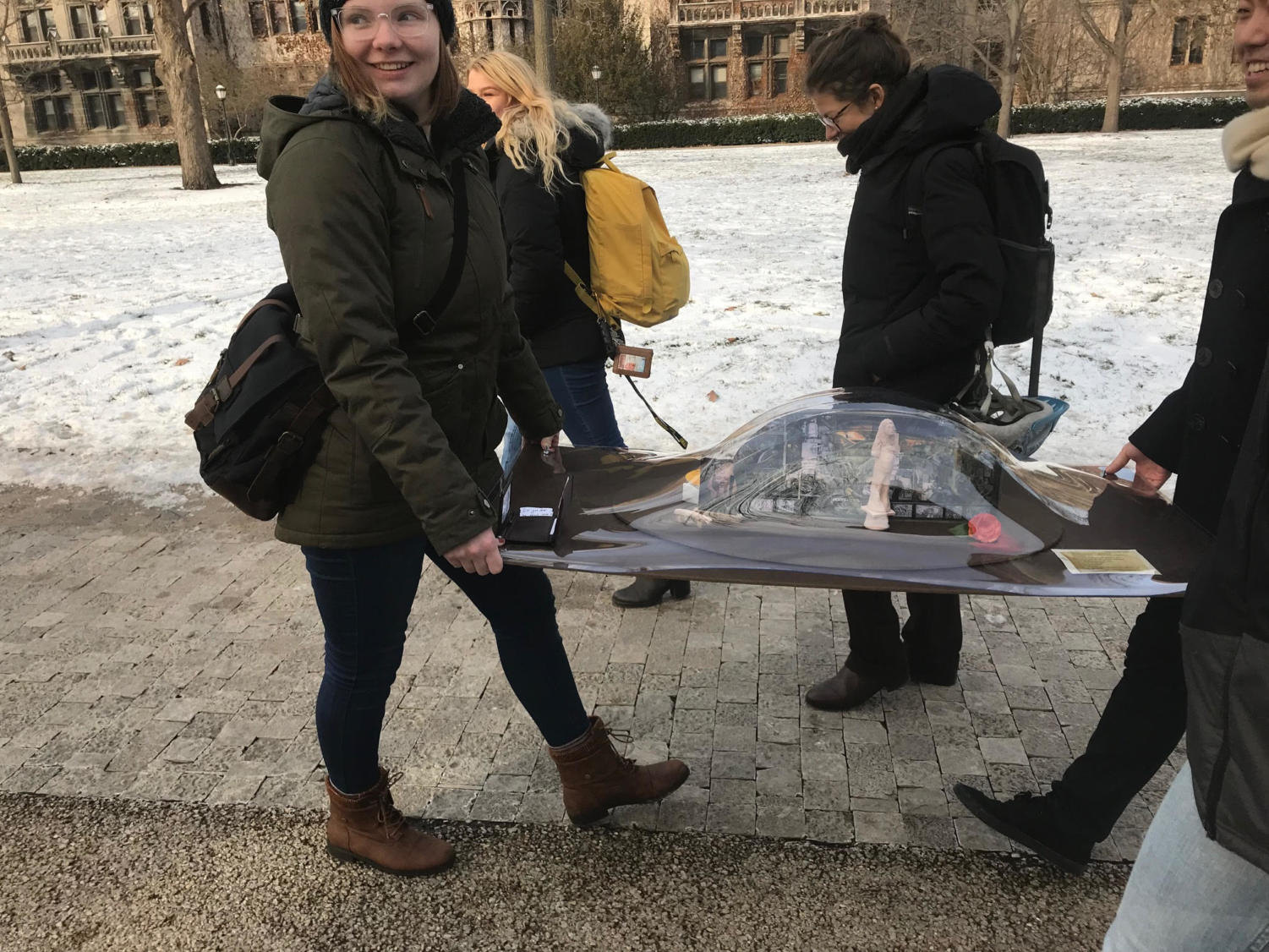 Deball, TA and phD in Political Science Tania Islas, and students Fan Ge, Magdalena Glotzer, Maggie Hart, Elliette Oliver, and Alex Warminski transport a portable museum across campus.