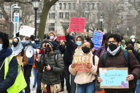 Community members march through campus as a part of a UChicago Against Displacement rally in February 2023.