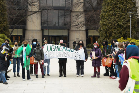 Community members protest in front of the Joseph Regenstein Library as a part of a UChicago Against Displacement Campaign.