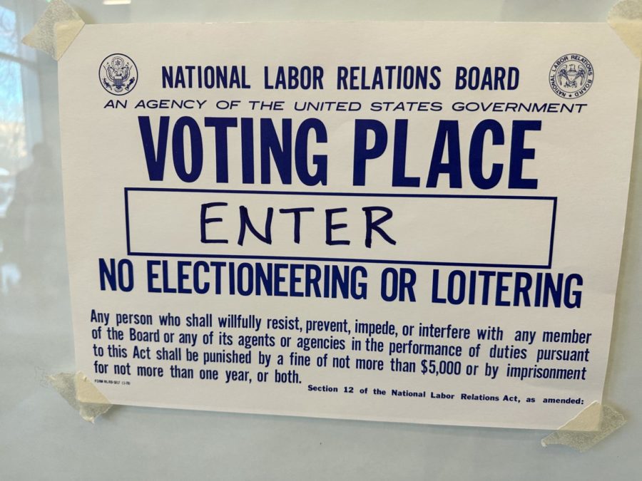 A sign posted on the door of the graduate student polling station in the Eckhardt Research Center.