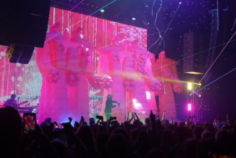 Accompanied by an array of lights and lasers, lead vocalist Wayne Coyne appeared centerstage, inside his signature bubble, between four colossal pink robot inflatables.