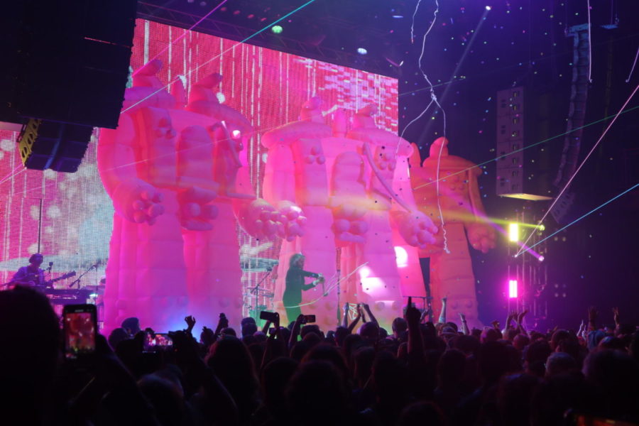 Accompanied by an array of lights and lasers, lead vocalist Wayne Coyne appeared centerstage, inside his signature bubble, between four colossal pink robot inflatables.
