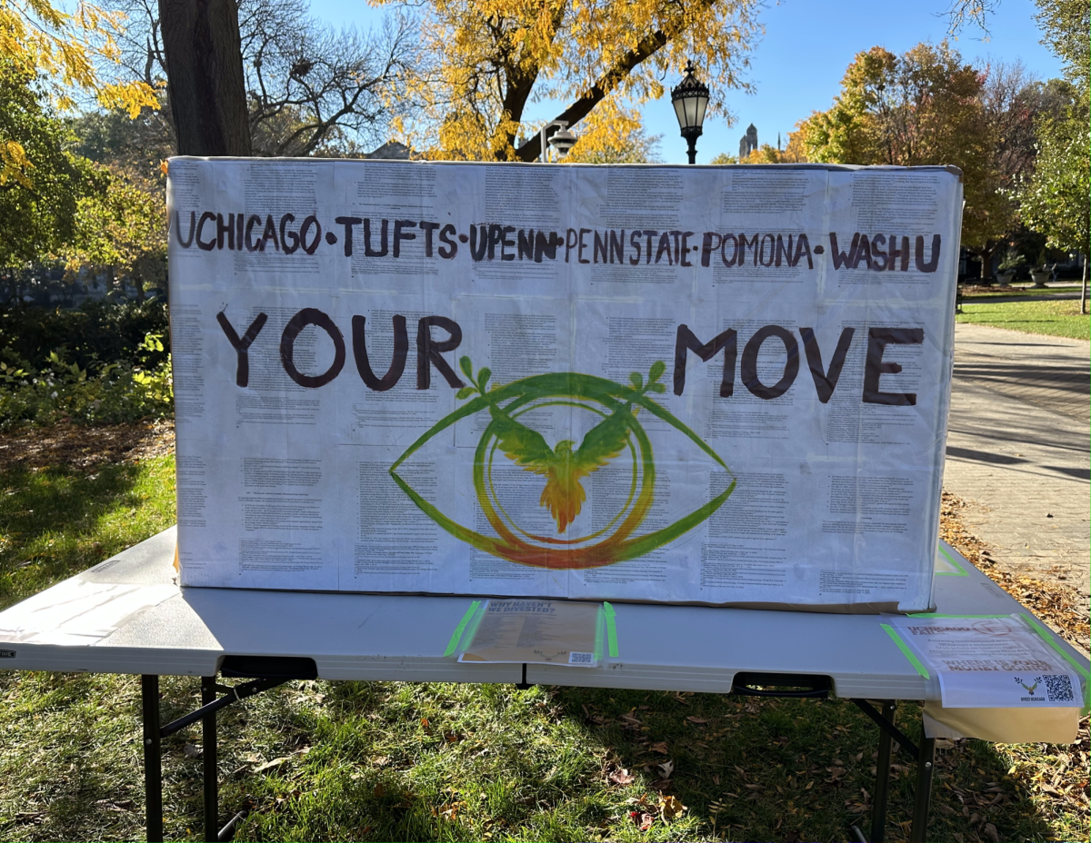 A sign calling for divestment is located on the North side of the quad.
