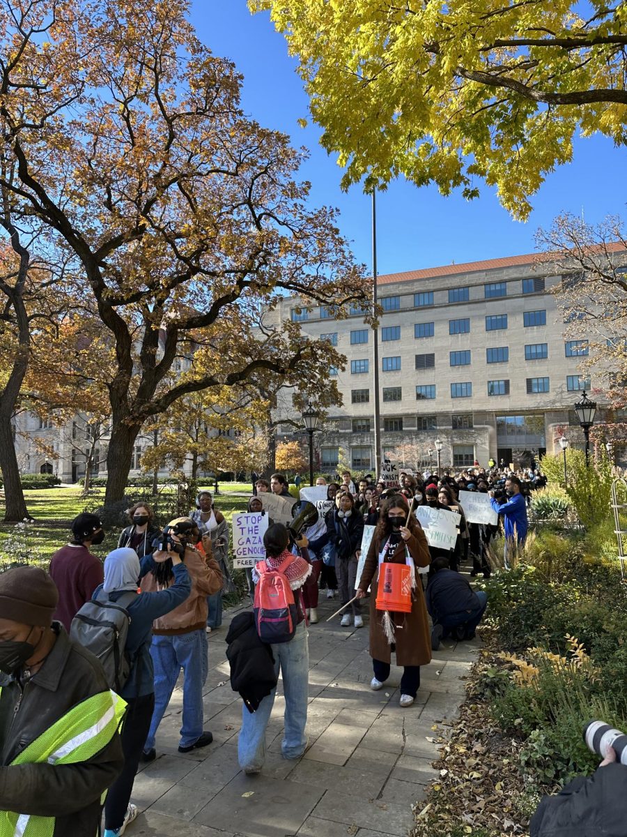 An SJP march in front of Levi Hall morphed into a march through the Quad to Rosenwald Hall.