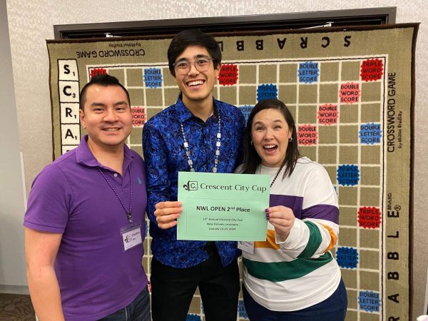 Cooper Komatsu (center) pictured with Austin Shin and Lindsay Crotty Shin, two of the Crescent City Cup tournament organizers.