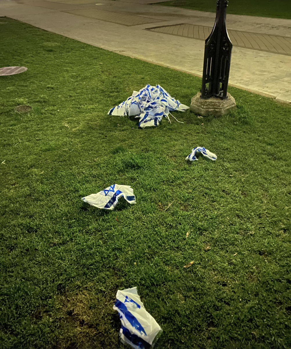 Israeli flags hung earlier in the day were taken down and found on the ground.