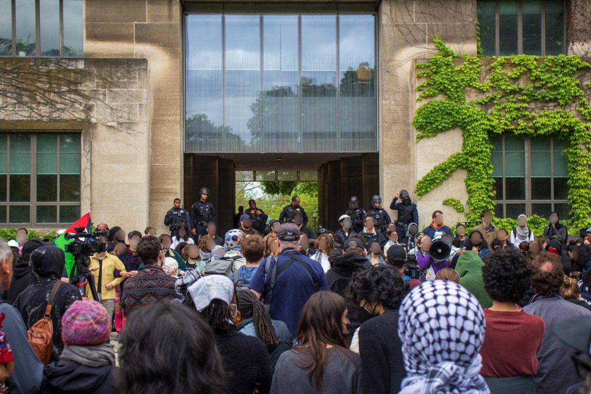 Pro-Palestine students and faculty rally in front of Levi Hall after Tuesday morning’s raid. 