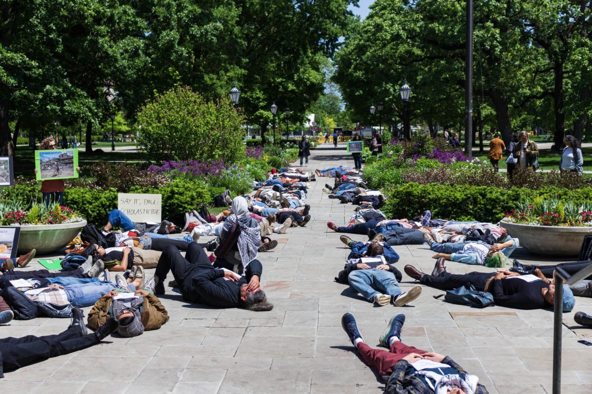 Members of Faculty for Justice in Palestine stage a die-in in front of Levi Hall.