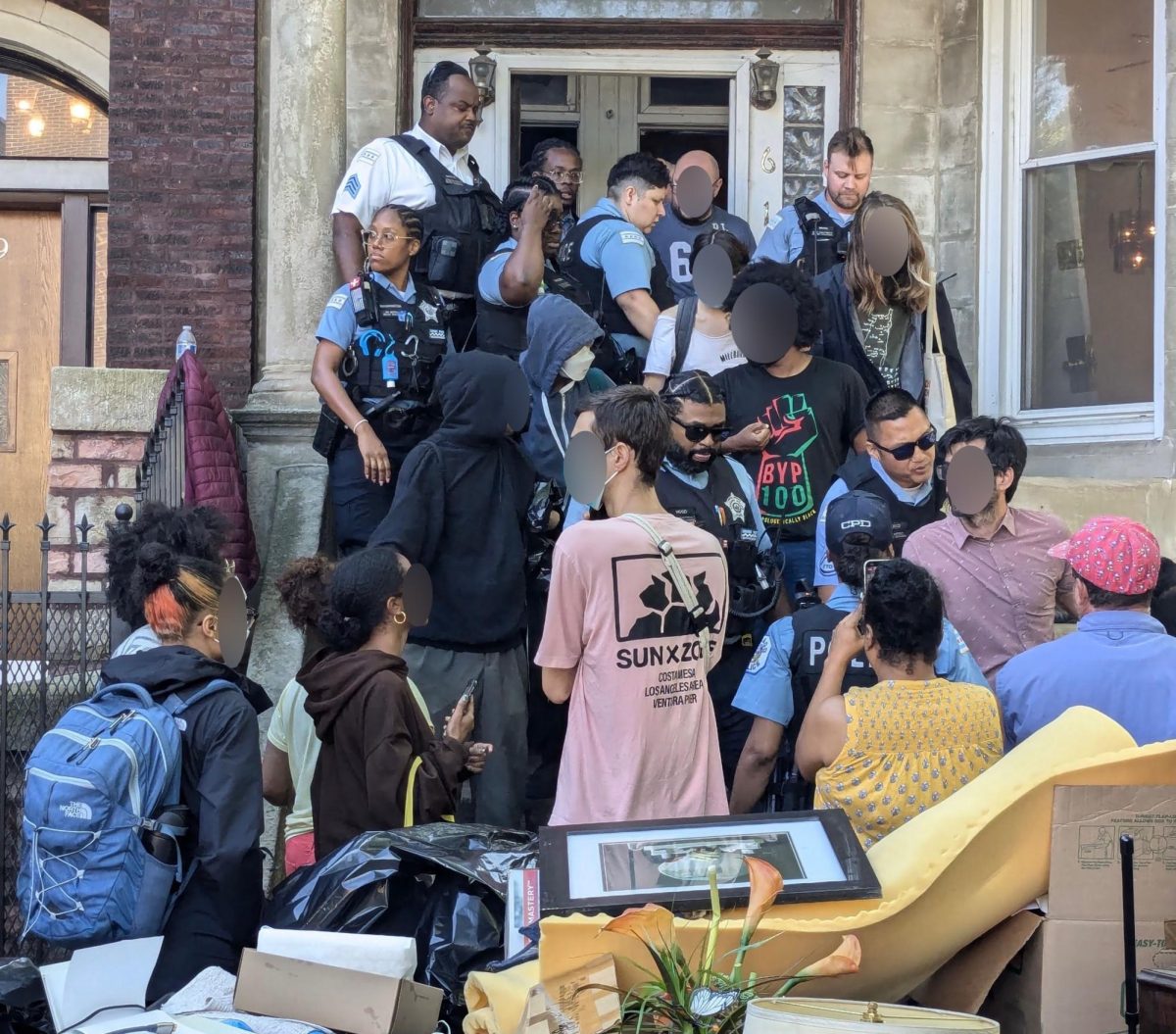 Police and protesters gathered outside the entrance to the building where Powell and her tenants lived (Courtesy of Dominic Surya).