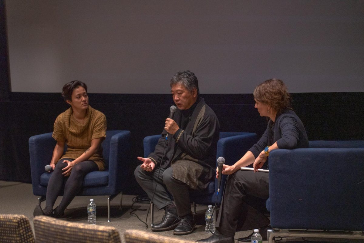 Director Hirokazu Kore-eda (middle) sits with professor Maria Belodubrovskaya (right) and translator (left) at the Reva and David Logan Center for the Arts. (Courtesy of Hannah Yang)