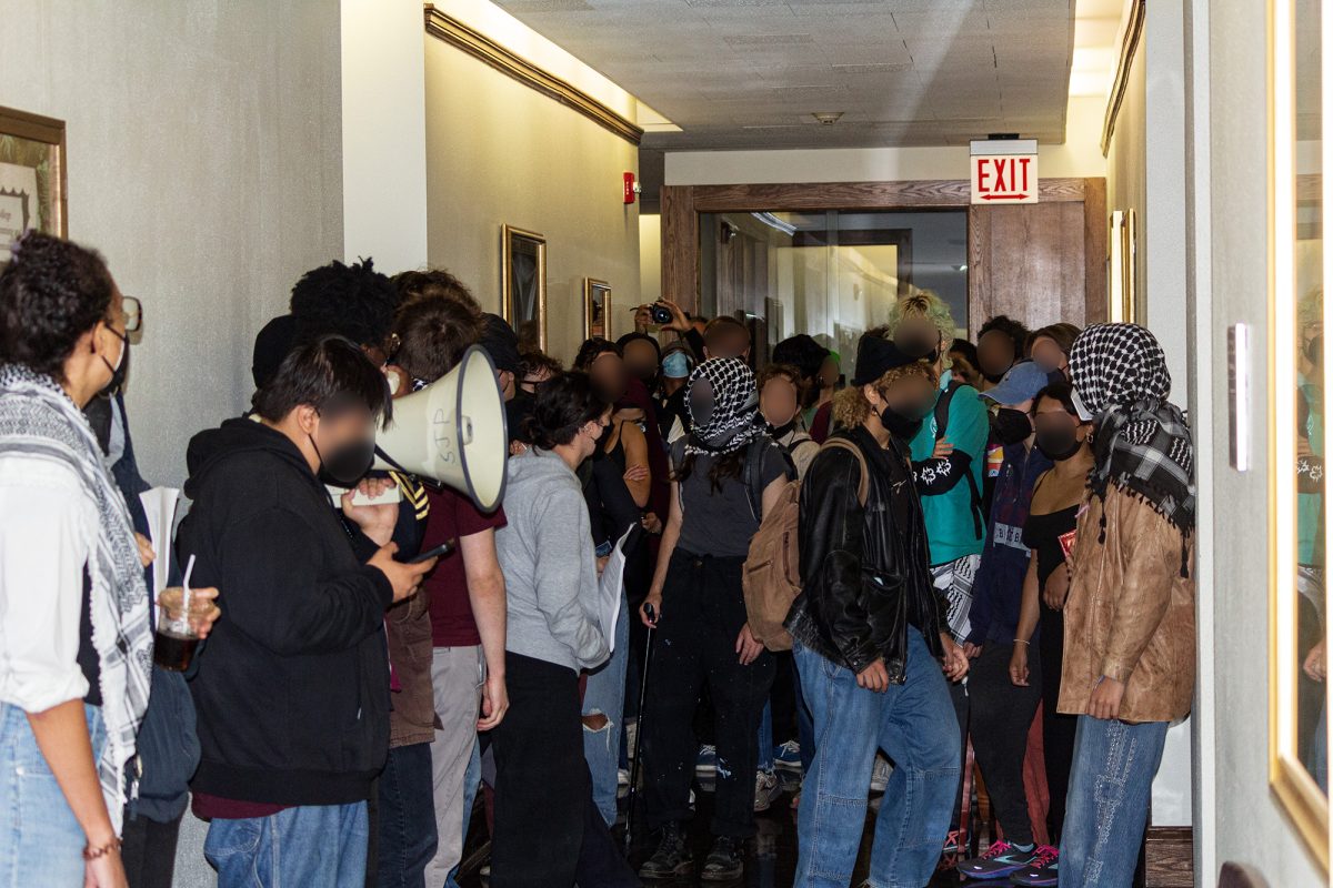 Protesters gathered in the hallway outside of Dean Venticinque’s office to deliver the petition.