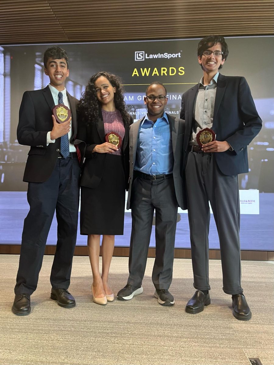 (Left to right) Vikram Ramaswamy, Cherie Fernandes, Zachary Harrison, and Pranav Padmanabhan pose with their awards at the Sports Law Arbitration Moot.
