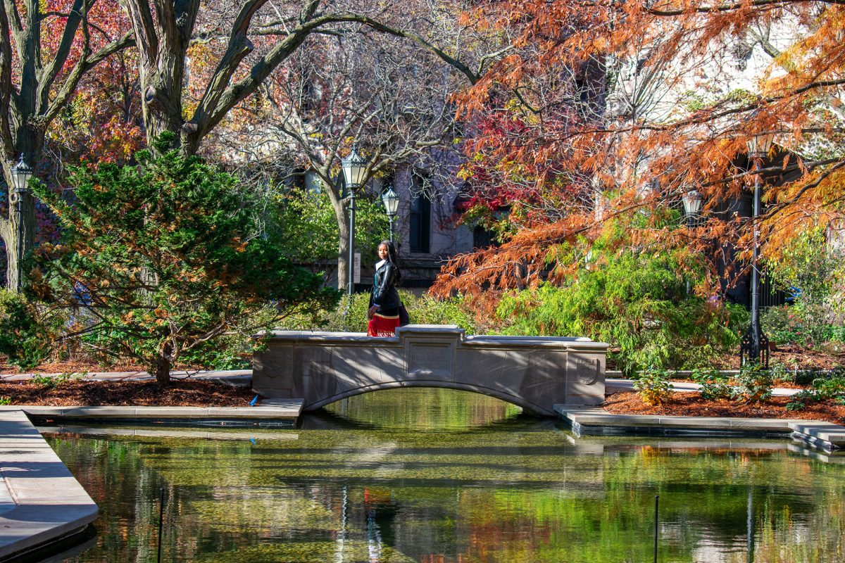 A student crosses the restored Botany Pond bridge.