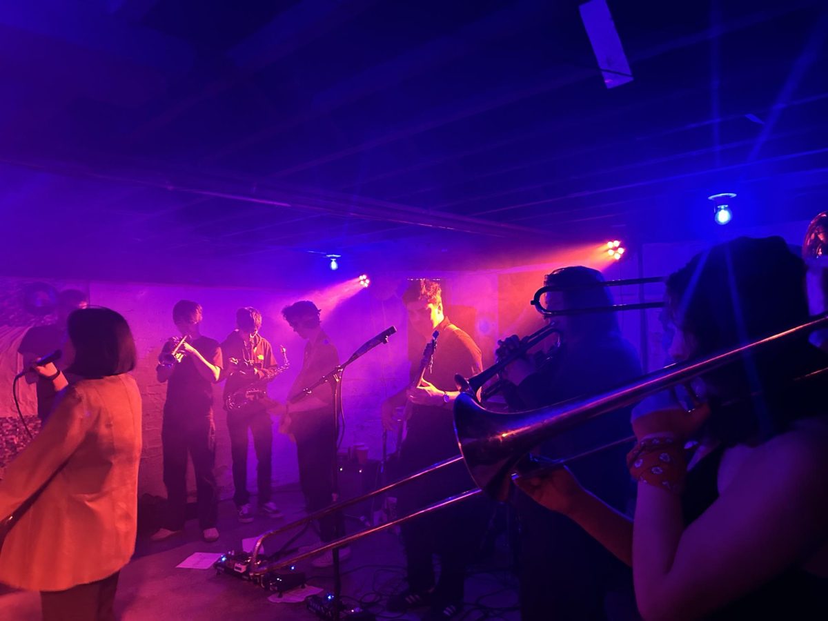 Dirt Red Brass Band performs at DKE fraternity house. 