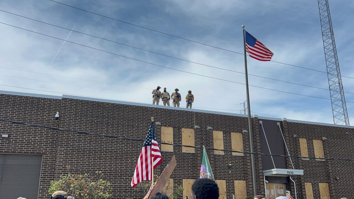 Federal agents stand on the roof of the Immigration and Customs Enforcement facility at Broadview on September 12, 2025. Courtesy of Emma Janssen.