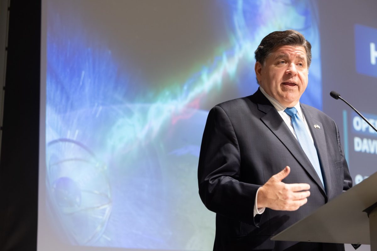 Illinois Governor J. B. Pritzker speaks to a crowd on the first day of the Chicago Quantum Summit. Courtesy of Anne Ryan.