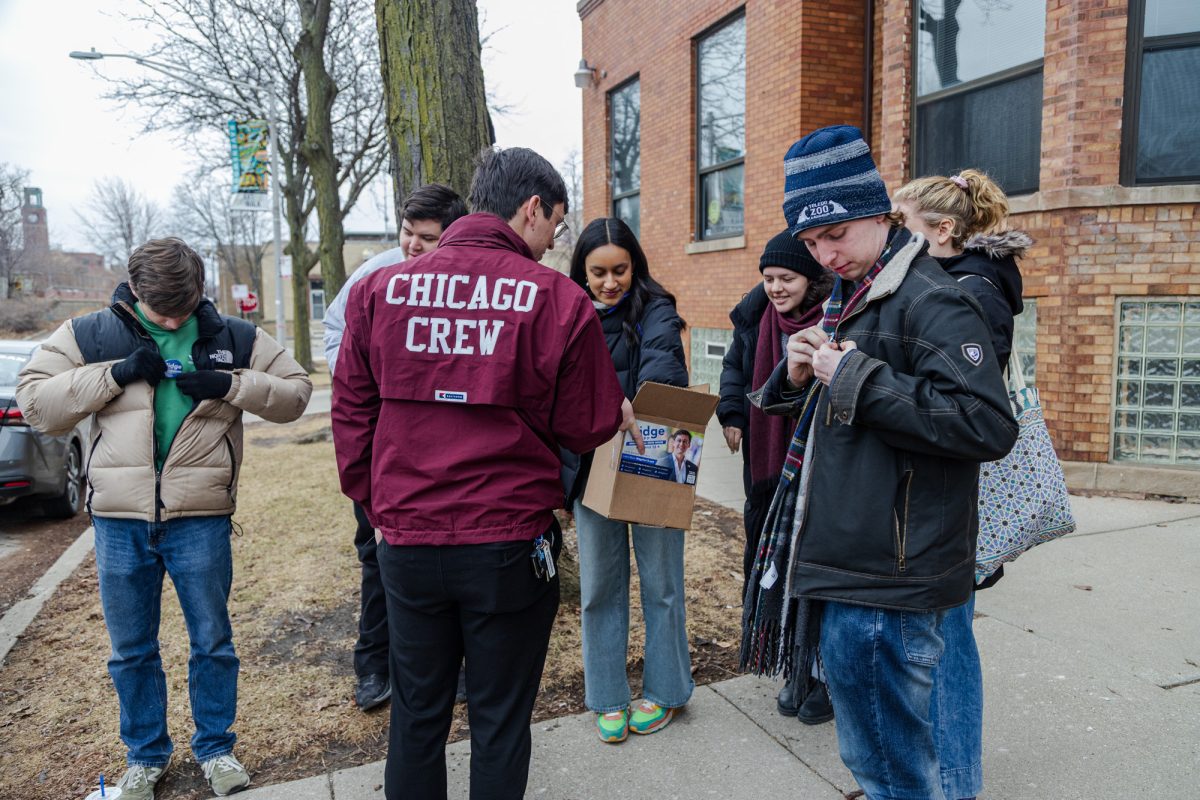 Knapp distributes buttons and campaign literature to UCDems members ahead of their canvassing efforts. 