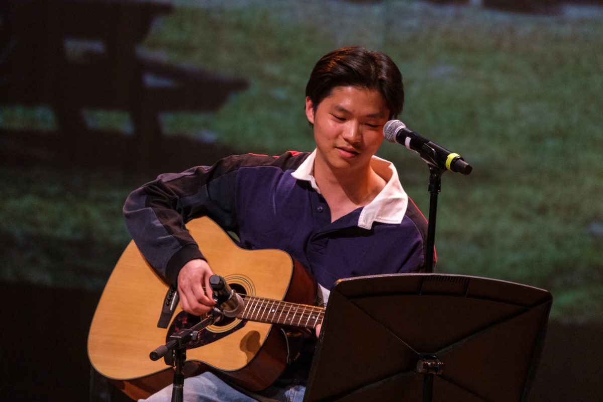 Aiden Gan sings and plays guitar in a duet with fellow third-year Abigail Ng.