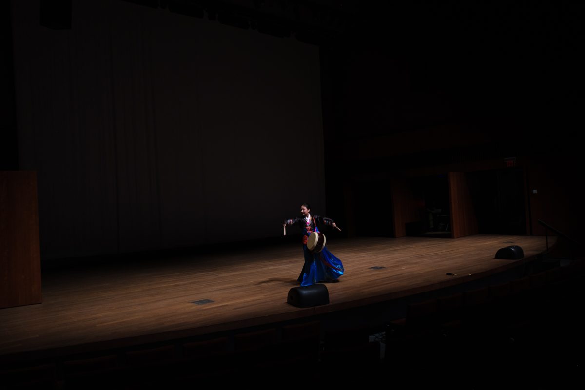 First-year Anna Cho performs a traditional Korean drum dance.