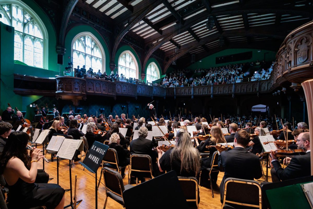 Barbara Schubert conducting the University Symphony Orchestra at Mandel Hall. Courtesy of Margo Strebig.