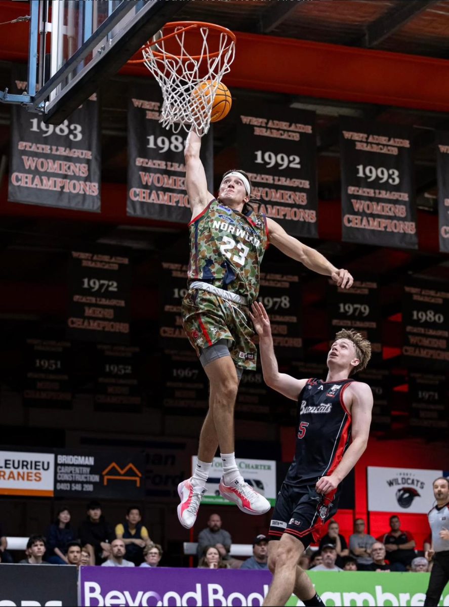Kurowski goes up for a dunk while playing for the Norwood Flames. Courtesy of Thomas Kurowski. 